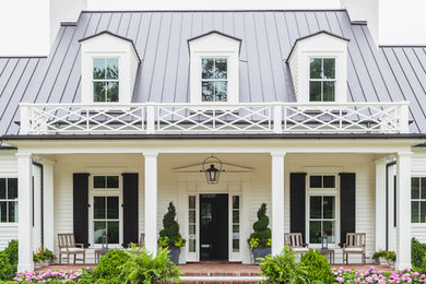Example of a classic white two-story exterior home design in Nashville