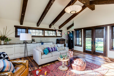 Country family room in Portland with medium hardwood floors and brown floor.