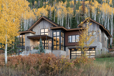 This is an example of a large rustic two floor detached house in Denver.