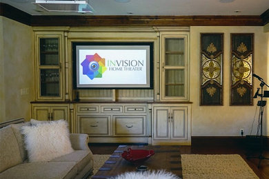 Inspiration for a mid-sized contemporary enclosed home theatre in San Francisco with a projector screen.