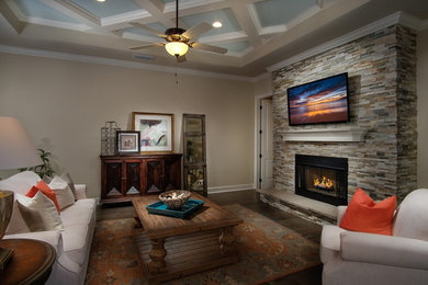 Photo of a mid-sized transitional formal living room in Tampa with dark hardwood floors, a standard fireplace, a stone fireplace surround, a wall-mounted tv, brown floor and beige walls.