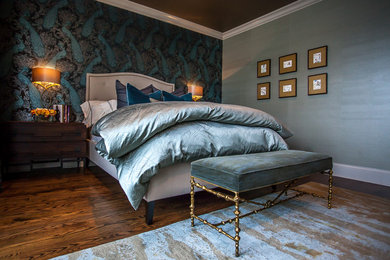Example of a transitional master medium tone wood floor bedroom design in Chicago with blue walls