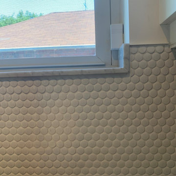 Plank tile Flooring and Penny tile Backsplash