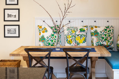 Inspiration for a mid-sized transitional light wood floor and beige floor kitchen/dining room combo remodel in Seattle with beige walls