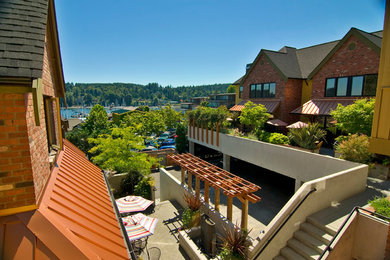 Mid-sized traditional three-story brick exterior home idea in Seattle
