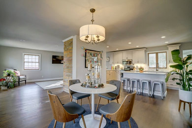 Example of a transitional dining room design in Other