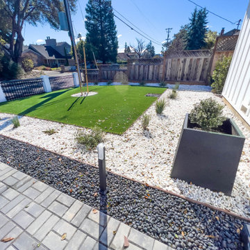 Modern Low-Maintenance Front Yard with Custom Fence and Artificial Turf