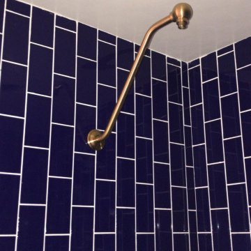 Blue Brick-Style Dimensional Tiles on the Shower Backsplash