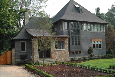 Inspiration for a large transitional multicolored two-story mixed siding exterior home remodel in Birmingham with a mixed material roof