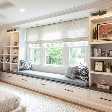 Master bedroom built-ins with storage drawers under the window seat.