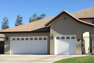 Inspiration for a mid-sized timeless garage remodel in Other