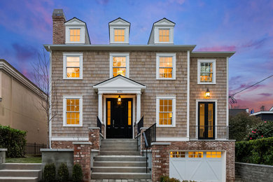 Traditional brown two-story wood and shingle house exterior idea in Seattle
