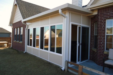 Patio - mid-sized modern backyard patio idea in Other with an awning