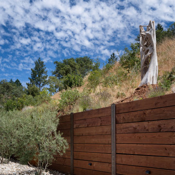 A little farm below a hillside resort-style off-the-grid view home
