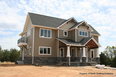 Arts and crafts brown two-story concrete fiberboard exterior home photo in Other