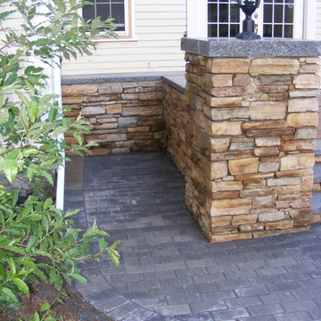 Deck and stone wall.