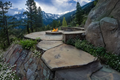 Example of a mountain style patio design in Denver