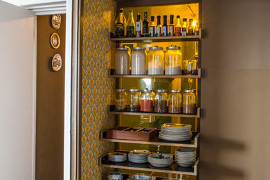 Small midcentury single-wall separate kitchen in London with open cabinets and dark wood cabinets.