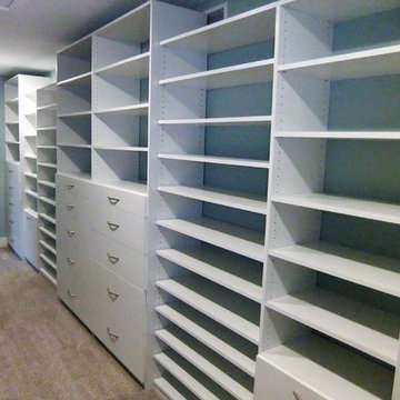 Closet-large walk-in w/drawers, hampers, regular and shoe shelving