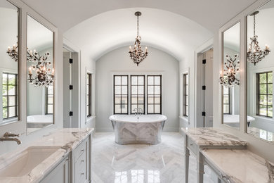 Large transitional master white tile and stone tile marble floor bathroom photo in Houston with furniture-like cabinets, blue cabinets, a bidet, blue walls, an undermount sink and marble countertops