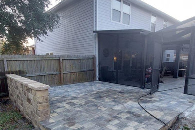 Mid-sized elegant backyard brick patio photo in Jacksonville