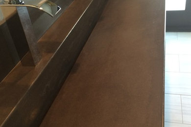 Inspiration for a contemporary bathroom remodel in Orange County with concrete countertops