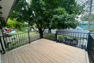 Inspiration for a mid-sized backyard second story metal railing deck remodel in Seattle