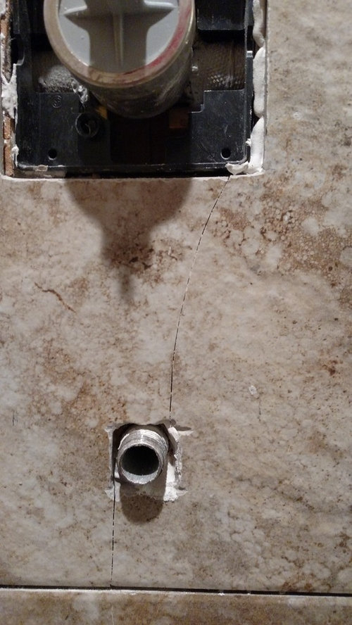 Tile cracked in shower & guy installed it yesterday