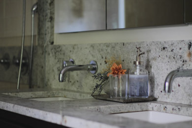 Bathroom - transitional master pink tile and ceramic tile marble floor and double-sink bathroom idea in New York with furniture-like cabinets, dark wood cabinets, a two-piece toilet, white walls, an undermount sink, granite countertops, a hinged shower door, gray countertops and a freestanding vanity