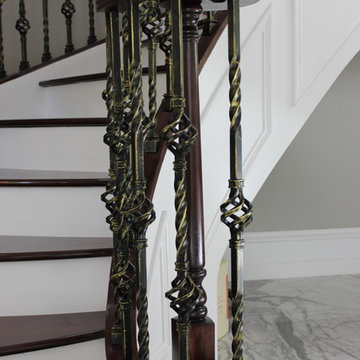 Walnut Circular Stair with Twist & Basket Iron Balusters
