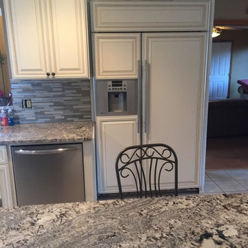 cabinet refacing--antique white with new granite and backsplash