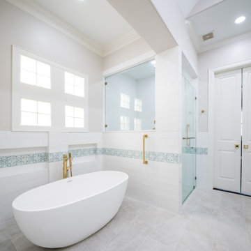Serene Spa-Like Bathroom with Freestanding Tub & Gold Fixtures