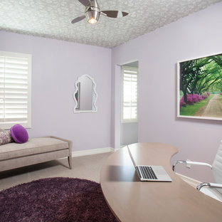 This is an example of a mid-sized contemporary study room in Orange County with purple walls, vinyl floors, no fireplace and a freestanding desk.