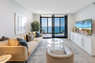 This is an example of a contemporary living room in Gold Coast - Tweed.