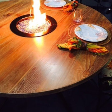 Round teak table with fire