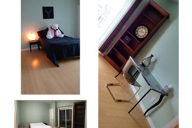 Foto de dormitorio minimalista de tamaño medio sin chimenea con paredes verdes y suelo de bambú
