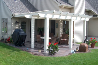 Inspiration for a timeless patio remodel in Other with a pergola