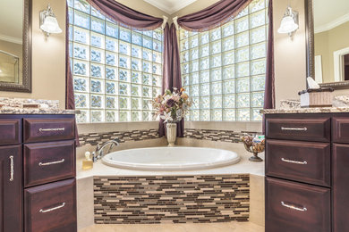 Bathroom - large traditional master beige tile and mosaic tile porcelain tile bathroom idea in Miami with raised-panel cabinets, dark wood cabinets, a two-piece toilet, beige walls, an undermount sink and granite countertops