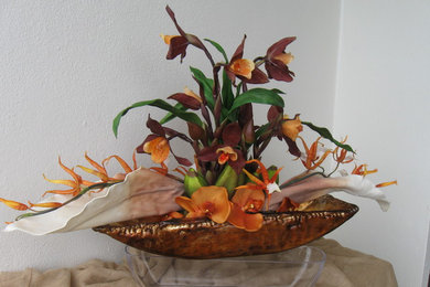 Orange orchids, Italian glass vessel, SUNSET