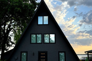 Example of a mid-century modern exterior home design in Other