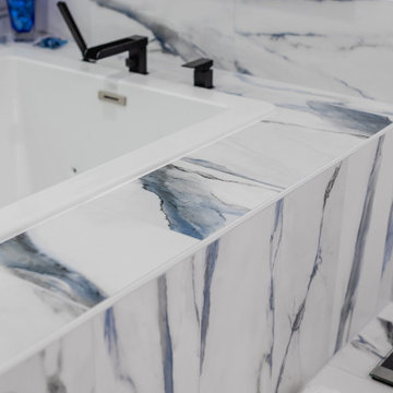 Bathroom remodeling in Columbia, MD with double vanity & marble bathtub