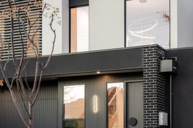 This is an example of a contemporary exterior in Melbourne.