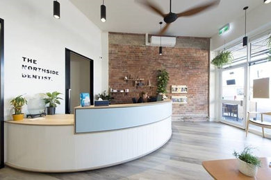 Design ideas for an expansive modern foyer in Melbourne with light hardwood floors.