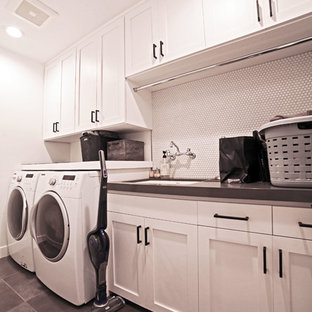 Design ideas for a medium sized contemporary single-wall separated utility room in Los Angeles with a submerged sink, shaker cabinets, white cabinets, composite countertops, white walls, slate flooring, a side by side washer and dryer, grey floors and grey worktops.