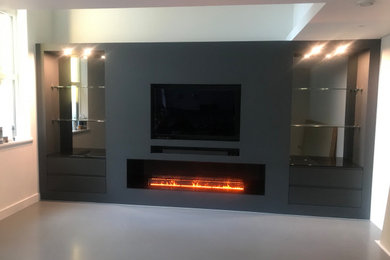 This is an example of a contemporary living room in Surrey.