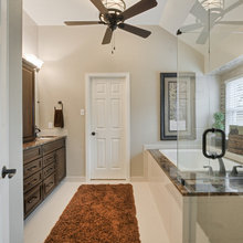 Shower next to bathtub