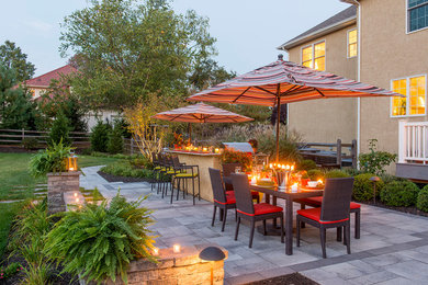 Example of a classic backyard patio kitchen design in Philadelphia