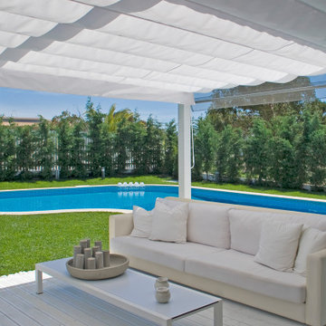 Pergola Terrace with White Outdoor Sofas