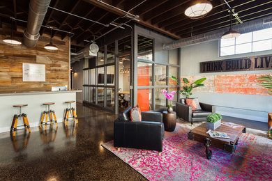 Large urban formal and open concept marble floor, brown floor, exposed beam and brick wall living room photo in Tampa with no fireplace, no tv and red walls