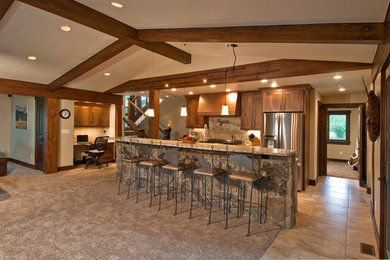 Inspiration for a large timeless single-wall ceramic tile open concept kitchen remodel in Denver with an undermount sink, medium tone wood cabinets, granite countertops, beige backsplash, stainless steel appliances, an island, stone slab backsplash and shaker cabinets